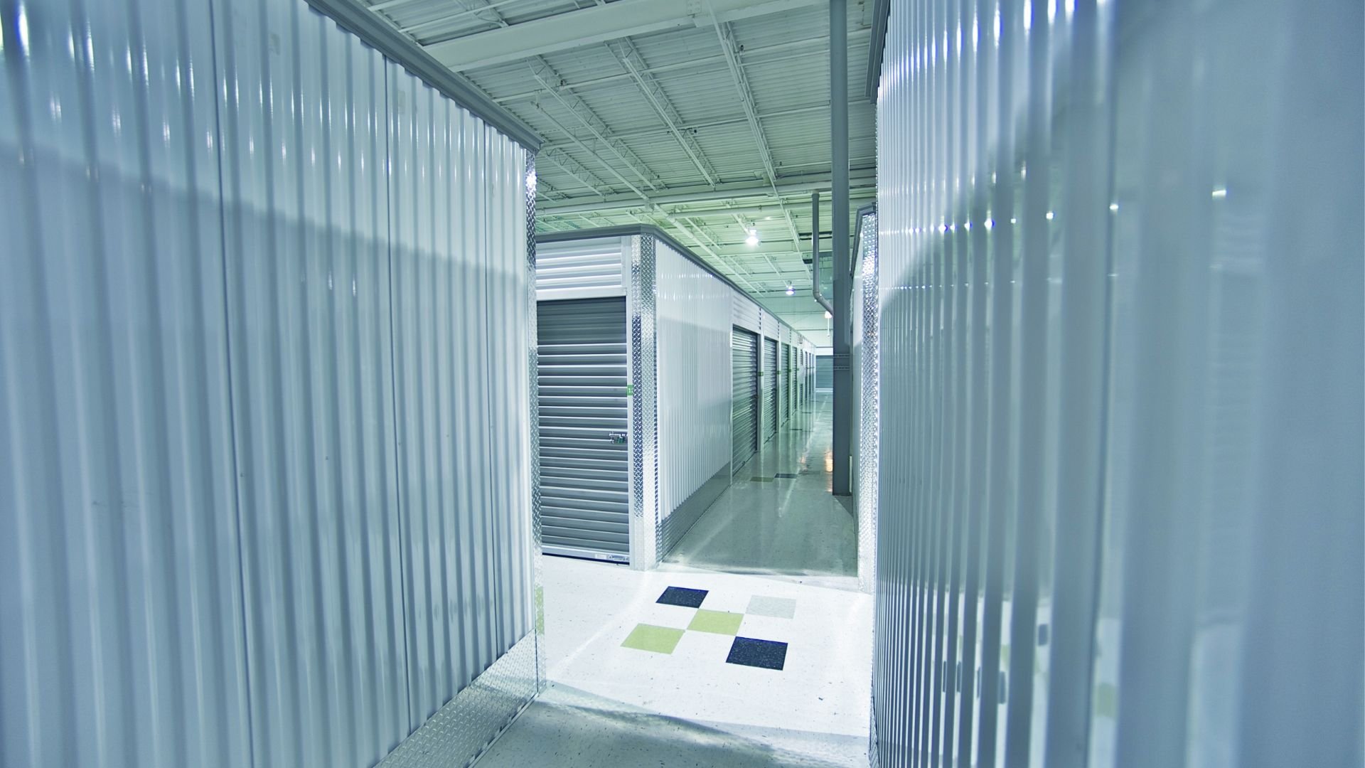 Clean, modern self-storage facility with metallic walls and roll-up doors